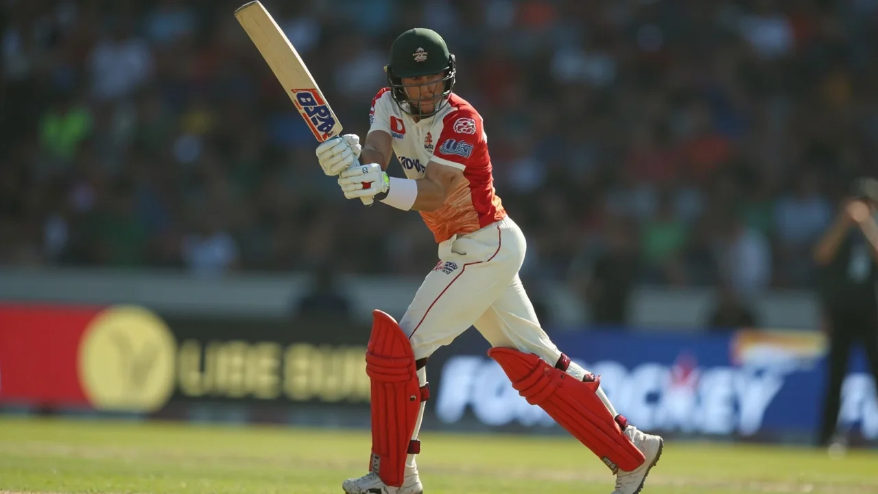 A Hundred fast bowler mid-stride at The Rose Bowl, front foot landing with the ball held high in the delivery hand